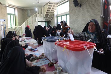 An Iranian woman casts her vote during parliamentary elections at a polling station in Tehran, Iran, on March 1, 2024. (Reuters)